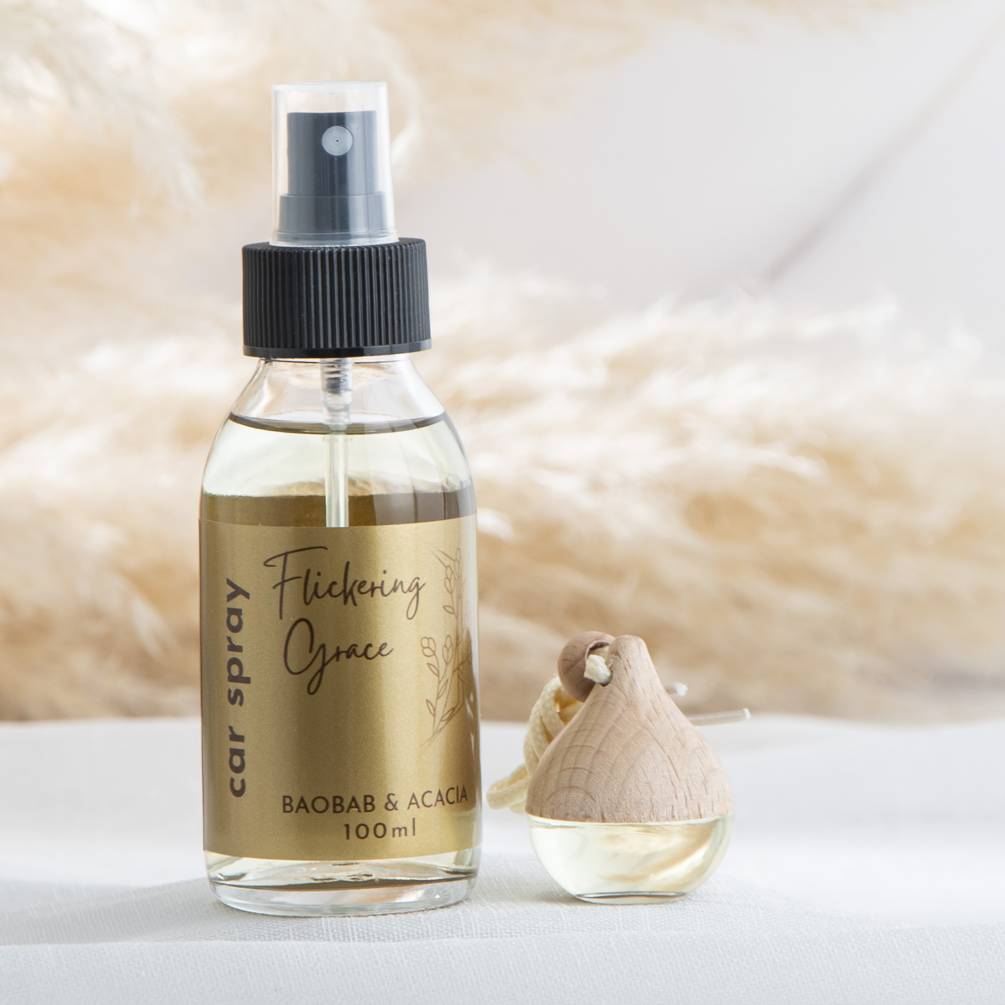 Car fragrance gift set with Baobab & Acacia car spray and car diffuser in a woody floral African‑inspired scent.