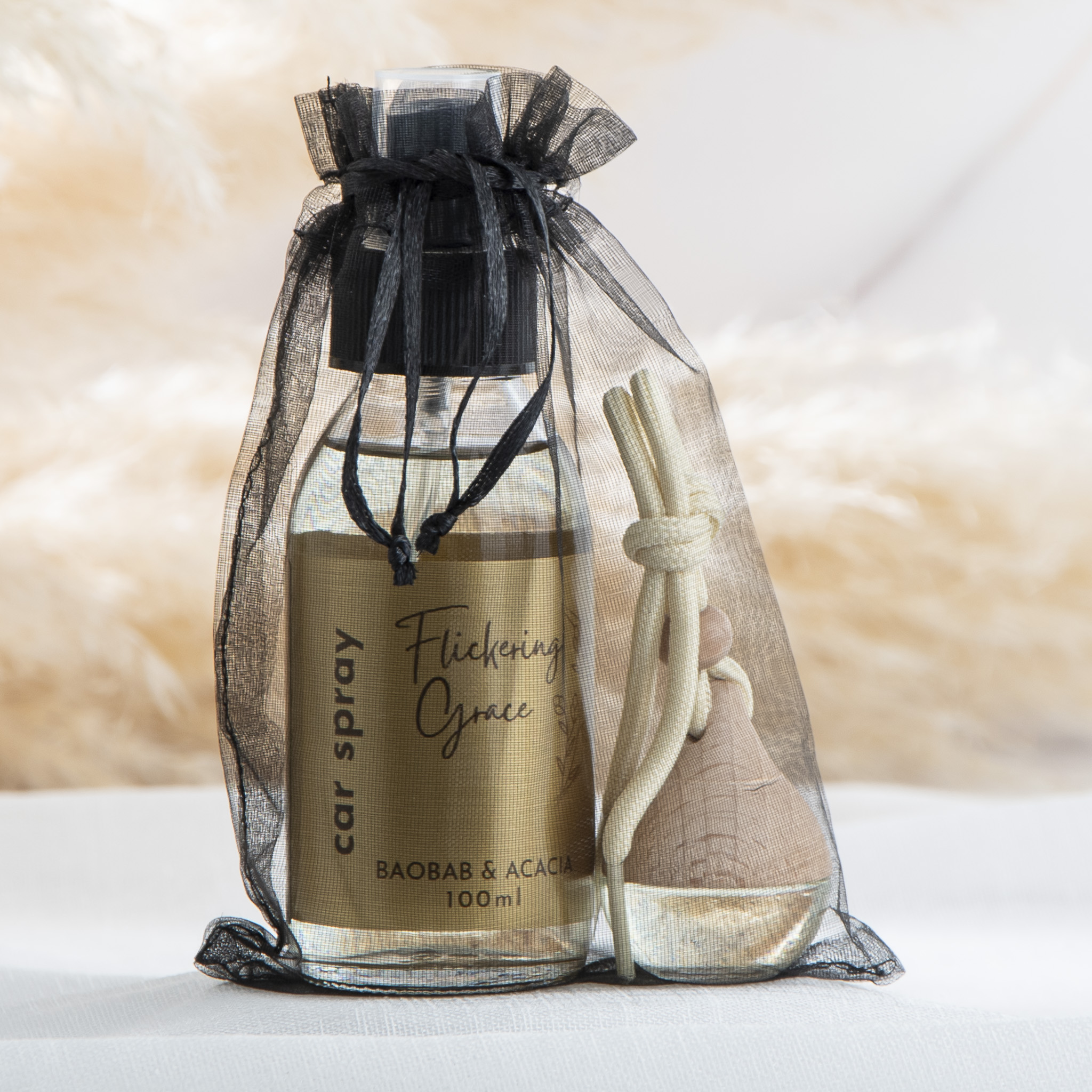 Car fragrance gift set with Baobab & Acacia car spray and car diffuser in a woody floral African‑inspired scent.