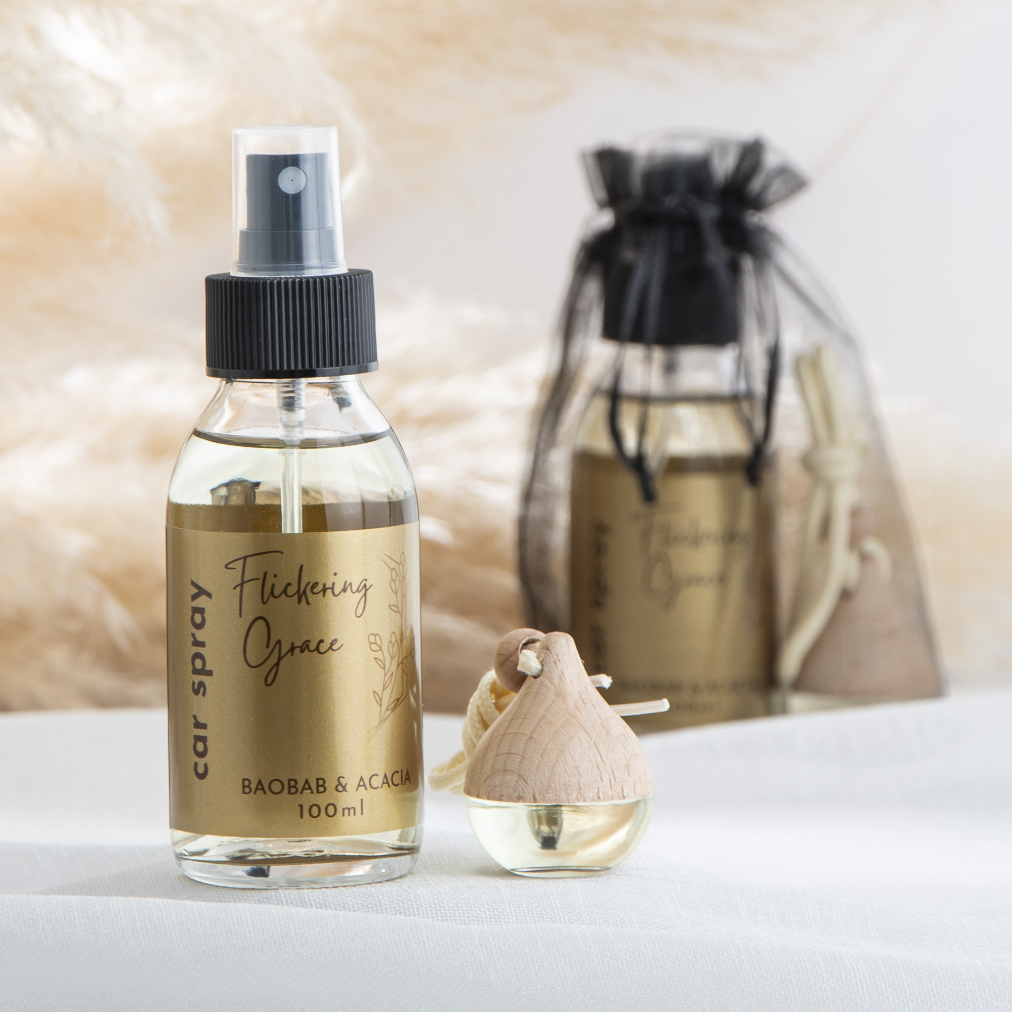 Car fragrance gift set with Baobab & Acacia car spray and car diffuser in a woody floral African‑inspired scent.